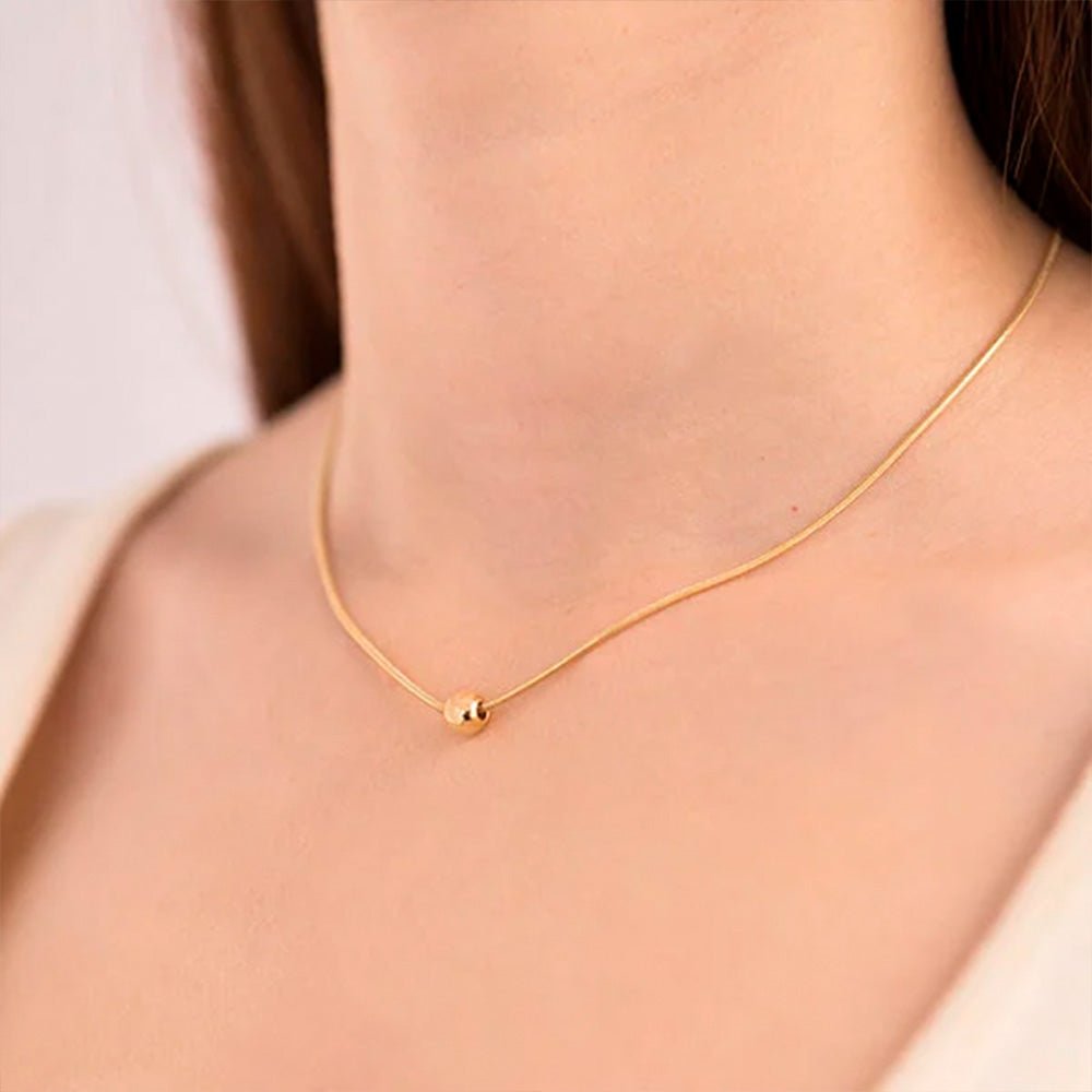 Collar bola oro