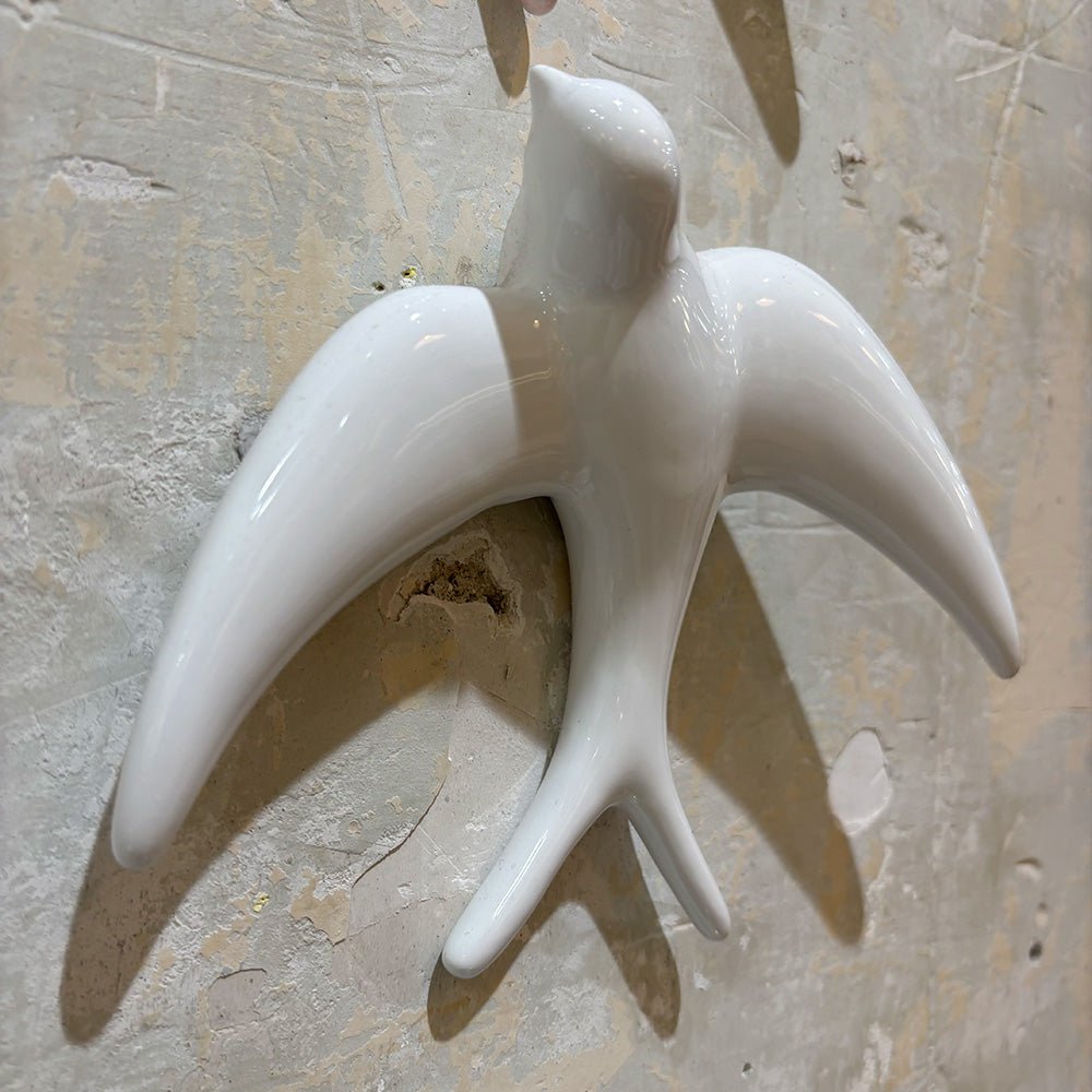Trio of White Swallows
