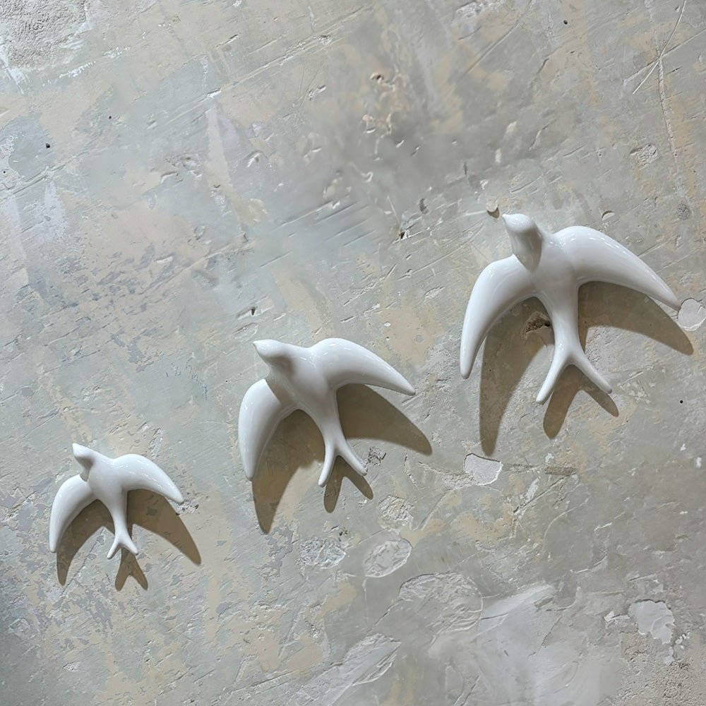 Trio of White Swallows