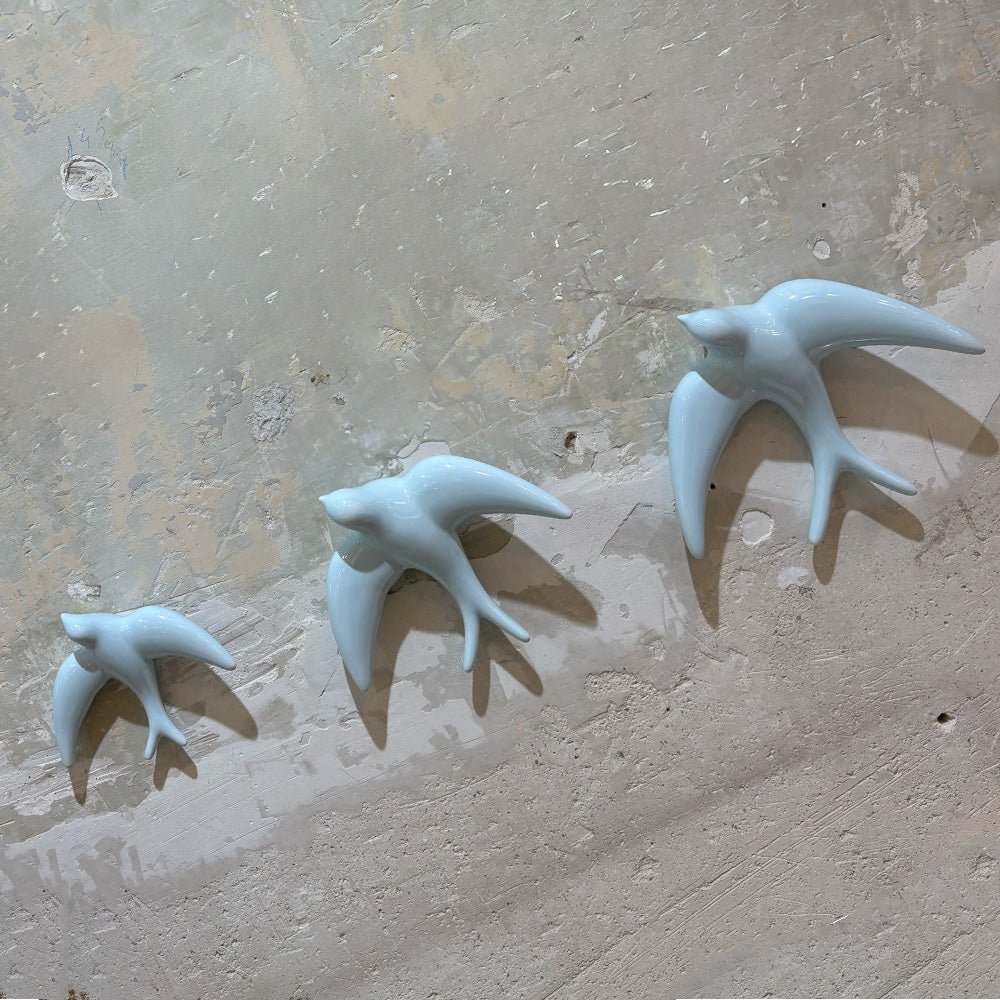 Trio of Light Blue Swallows