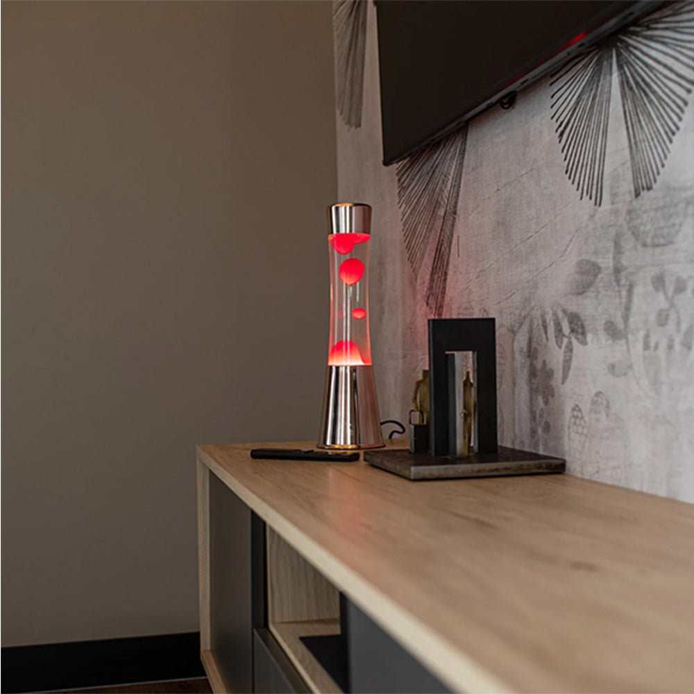 Lampe à lave avec base or rose, liquide transparent et lave magenta